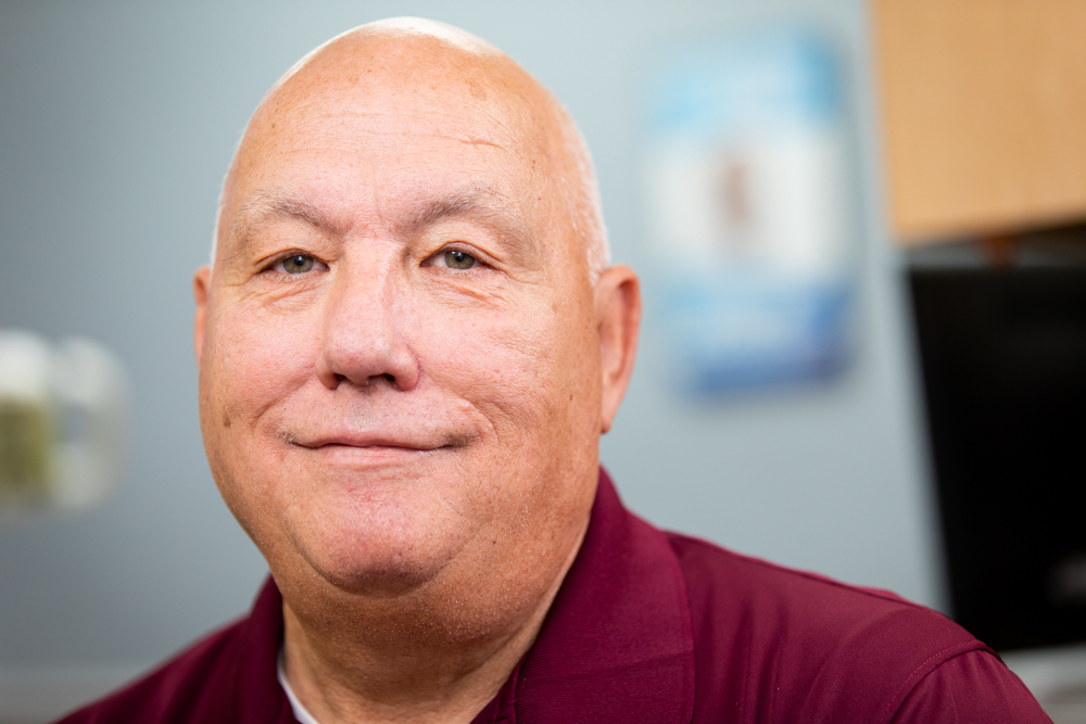 Older patient smiling after getting smile makeover at Regional Dental Center Jacksonville, AL